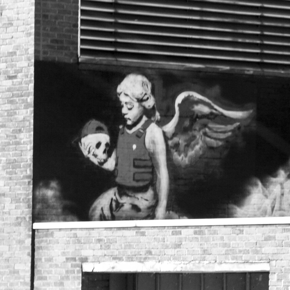 banksy angel with skull